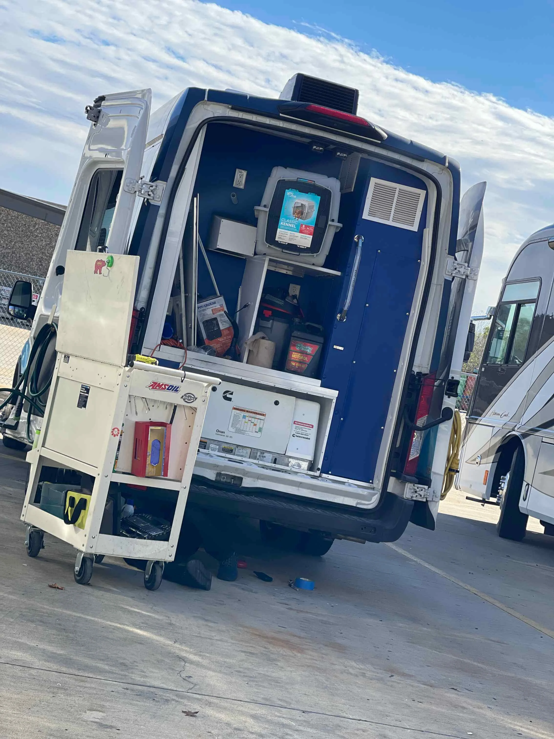 Specialty Van Service By Gene Technician Gene servicing specialty grooming van systems for reliable daily operation